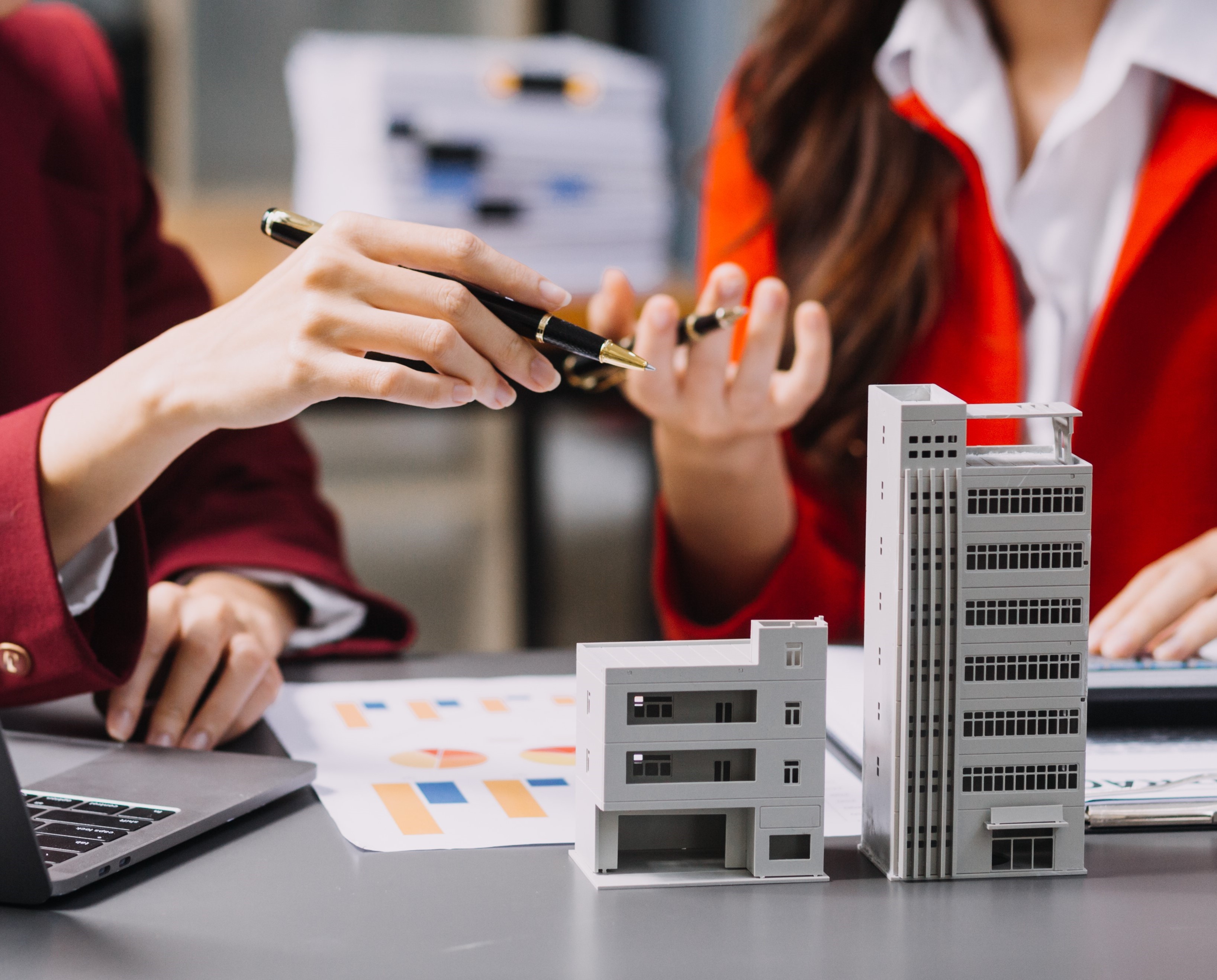 Hotel asset management team analyzing financial data