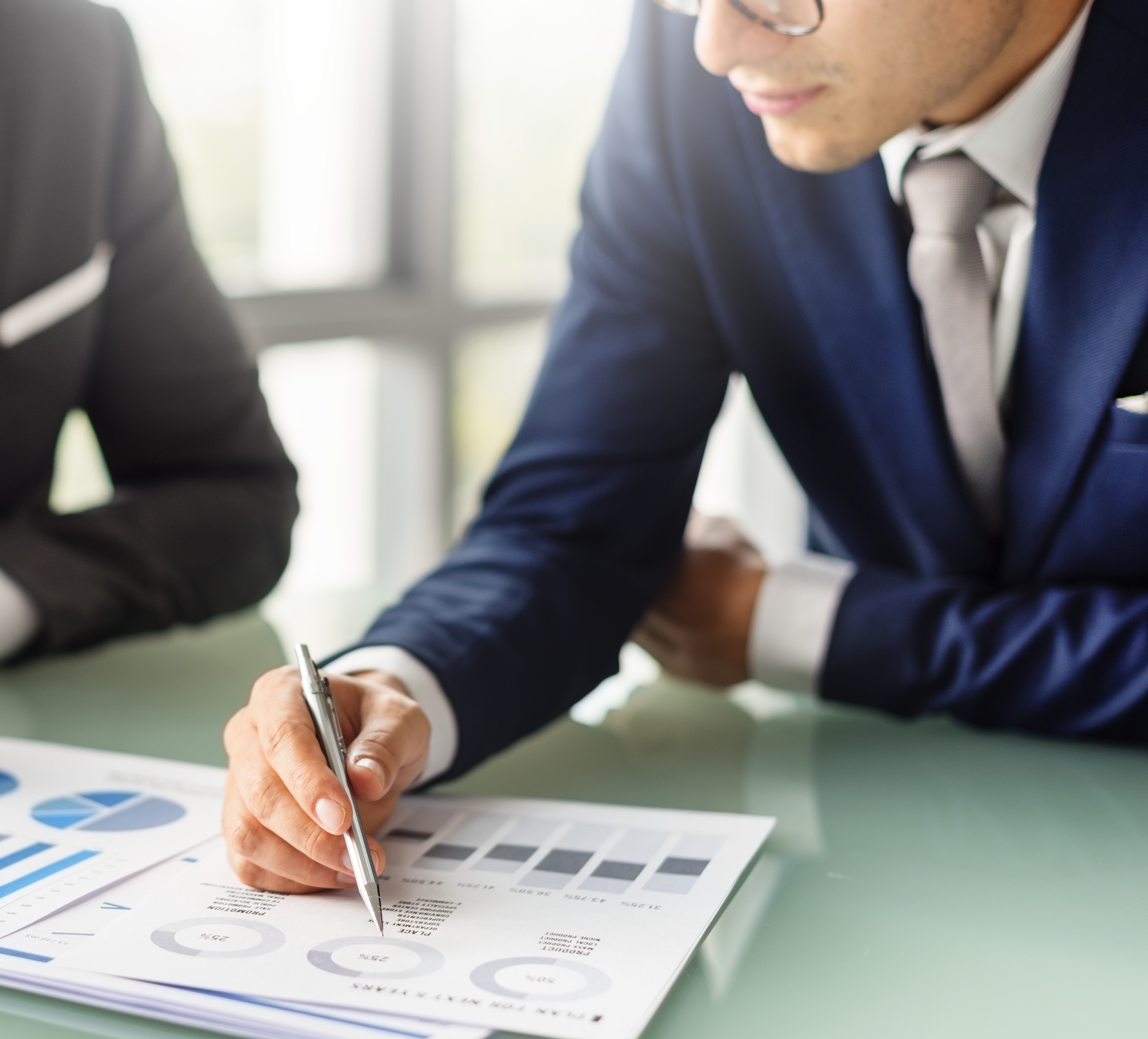 Expert analysing hotel feasibility study documents